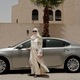 In this Sunday, June 24, 2018 photo, Ammal Farahat, who has signed up to be a driver for Careem, a regional ride-hailing service that is a competitor to Uber, poses for a photograph next to her car on a street in Riyadh, Saudi Arabia.